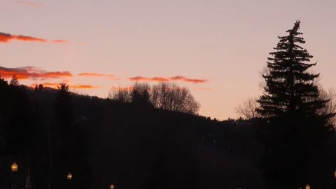 Time lapse of clouds above mountains during sunset Stock Footage 84505493