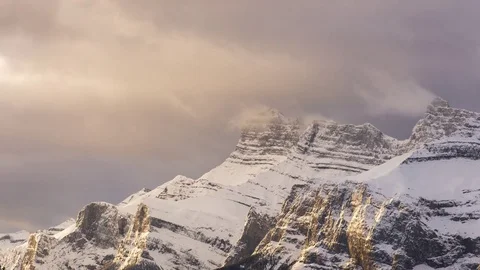 Time lapse of clouds above snowy mountain peaks Video stock 85371551