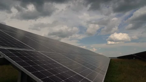 Time lapse. Clouds above solar panel generating plant Stock Footage 135713536