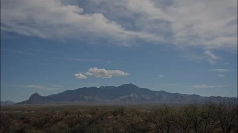 Time lapse of clouds above a vast mountain range in the desert southwest Stock Footage 328641221