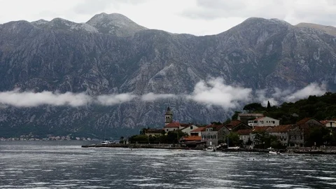 TIME LAPSE - clouds above the water in the Bay of Kotor Stockbeeldmateriaal 115832393