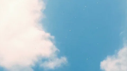 Time-lapse of Clouds Against Bedroom Skylight with Blue sky Stock Footage 90894110