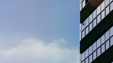 Time lapse of clouds against a generic office building Stock Footage 68171858