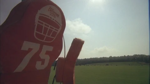 Time-lapse of clouds and American football tackling dummy in a field Stock Footage 105422770