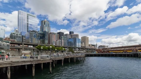 Time lapse of clouds and blue sky over Seattle city along waterfront pier 4k uhd Stock Footage 76854992