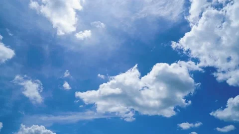 Time-lapse clouds and blue sunny sky,  white clouds over blue sky, Video stock 217233405