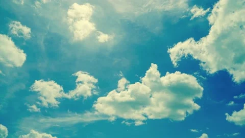 Time-lapse clouds and blue sunny sky,  white clouds over blue sky, Aerial view,  Video stock 223448634
