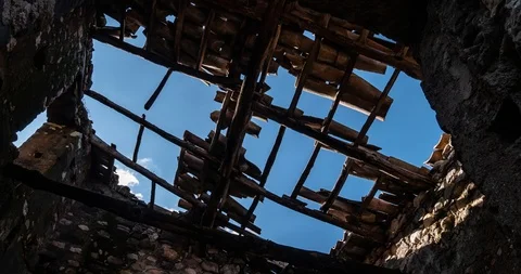Time lapse clouds and broken roof with dangling tiles Stock Footage 124641678