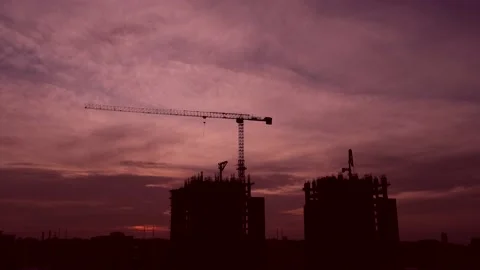 Time lapse of clouds and a building under construction at sunset Stock Footage 148423261