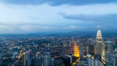 Time lapse of clouds and of city traffic in Kuala Lumpur Malaysia 4k uhd Stock Footage 71543423