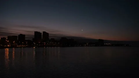 Time-lapse with clouds and city in the background on the coast Stock Footage 157690693