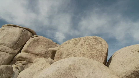 Time Lapse of Clouds and Desert Rocks - Clip 3 Stock Footage 717300