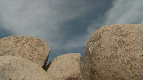 Time Lapse of Clouds and Desert Rocks - Clip 4 Stock Footage 717404