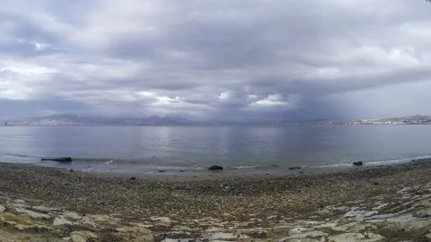 Time lapse clouds and emerging rainbow in dark gray air. Vídeo Stock 157830588