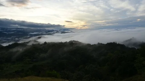 Time lapse of clouds and fog moving over on doi huamod at umphang,Thailand Stock Footage 80411899