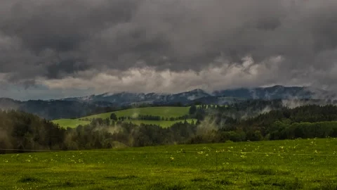 Time lapse clouds and fog over the meadow Stock Footage 132174398