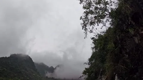 Time-lapse of Clouds and Fog over Green Bushes Stock Footage 240880966