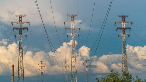Time lapse of clouds and high-voltage power lines Stock Footage 129966701