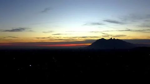 Time lapse of Clouds and Iconic Mountain Silhouette during Sunrise Video stock 263383240