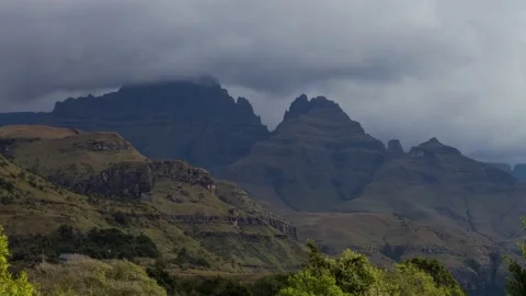 Time lapse of clouds and light over Cathkin peak in Maloti Drakensberg Stock Footage 155387678