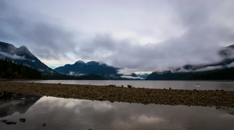 Time Lapse Of Clouds and Mist Over Lake With Reflection Stock Footage 50589256