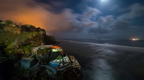 Time lapse of clouds and moon over coast of Bali Stock Footage 68824650