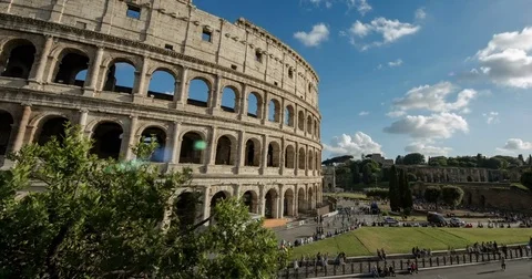 Time-Lapse of clouds and people near historic structure in 4K Video stock 73185700