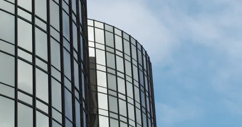 Time lapse clouds and reflecting glass towers 4K Stock Footage 64057909