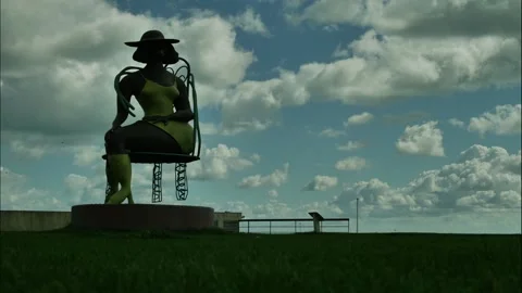 TIME LAPSE CLOUDS AND SEATED SCULPTURE AT DE LA WARR PAVILION 4K Stock Footage 289735238
