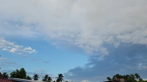 Time Lapse of clouds and sky on a summer morning, in the village of Masolo Pinra Stock Footage 242470189