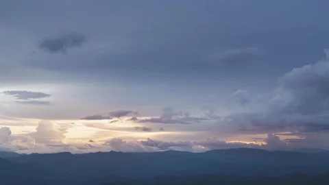 Time lapse of Clouds and sky over mountain in evening sunset. Stock Footage 247399366