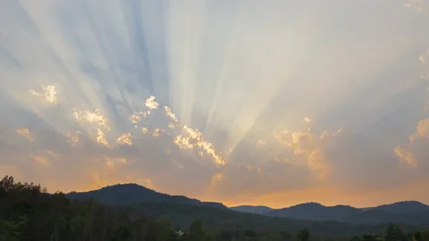 Time lapse of Clouds and sunbeam over mountain in evening. Stock Footage 149474010