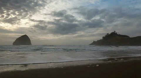 Time Lapse of Clouds and Waves with Haystack Rock in Cape Kiwanda OR at Sunset Stock Footage 43235084