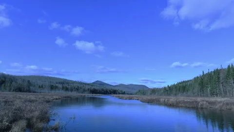 Time lapse of clouds and wind on river Stock Footage 143205349