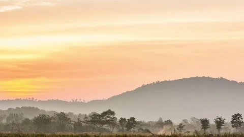 Time-lapse clouds are moving above mountains Stock Footage 74128092
