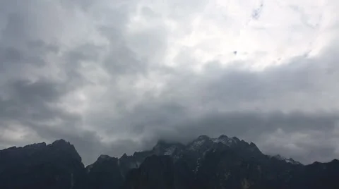 Time lapse of clouds around Mountain Peak with snow around Tiger leaping gorge Stock Footage 49034982