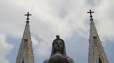 Time lapse of clouds behind Nortre dame cathedral and marble Virgin Mary Stock Footage 38107887
