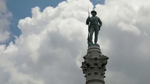 Time Lapse Clouds Behind Statue of Soldier Stock Footage 76907213
