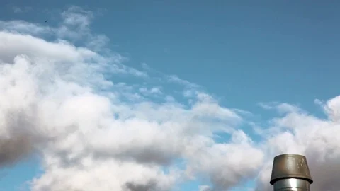 Time lapse of clouds in a blue sky with a chimney 2 Video stock 106539250