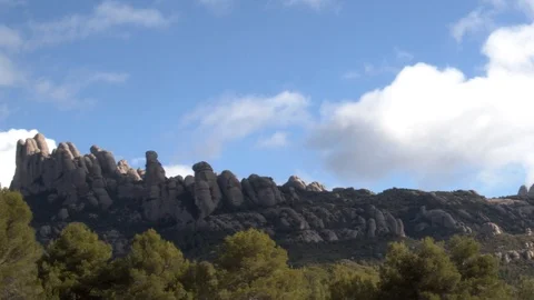 Time lapse of the clouds the blue sky and the mountain of Monserrat in Catalonia Stock Footage 123045462