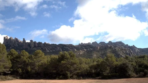 Time lapse of the clouds the blue sky and the mountain of Monserrat in Catalonia Stock Footage 123045562