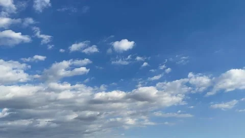 Time lapse of clouds in a blue sky Stock Footage 168771548