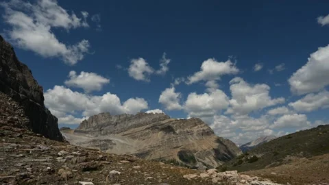 Time lapse of clouds building above majestic mountains in Banff National Park.  Stock Footage 273346719