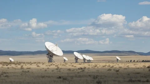 Time lapse of clouds casting shadows on astronomical radio antennas at VLA Stock-Footage 108335352
