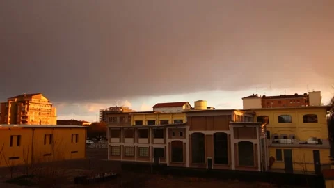 Time lapse Clouds change color over the buildings 4K - Italian nature Video stock 151197228