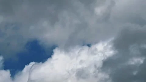 Time lapse clouds changing from blue sunny sky to storm and back Stock Footage 334075651