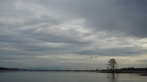Time-lapse clouds dancing on a lagoon Stock Footage 281054212