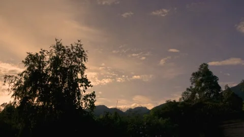 Time lapse of the clouds at dawn as the sun rises over the Iguaque natural re Stock Footage 314527706