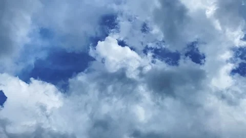 Time-Lapse of Clouds Drifting Across a Blue Sky Stock Footage 300771811