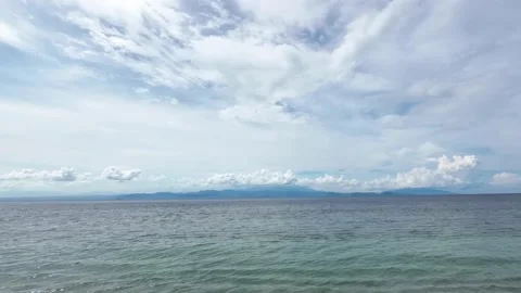 Time-lapse of Clouds Drifting Over Calm Ocean Waters, Bali Stock Footage 238005414